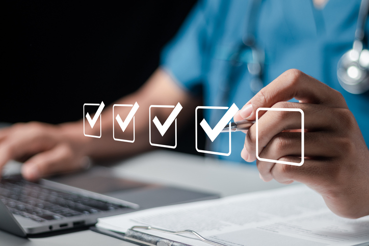 Doctor fills out the medical survey paperwork and checking mark on checkboxes. Are there any adverse effects or issues with laser treatment